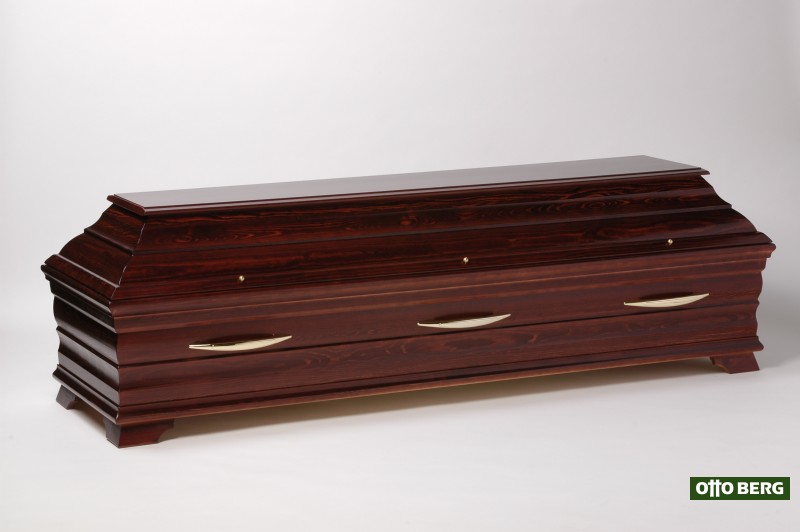 Kiefernsarg Alea (rubinrot) - Hochwertiger Truhensarg aus Kiefernholz mit Kehlungen im Ober- und Untersarg und 6 goldfarbenen Sarggriffen. Oberfläche: rubinrot gebeizt und lackiert.